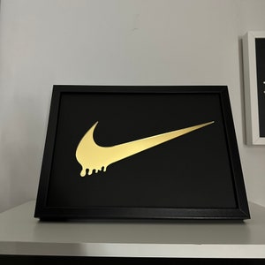 Gold 2025 nike sign