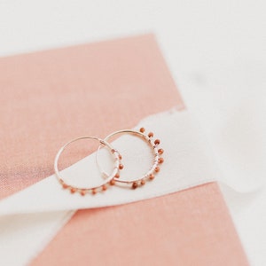 Hoop earrings with tiny 2.5mm golden aventurine gems. These earrings are dainty and minimalist, with a bohemian touch, and are rose gold plated. The tiny aventurine beads on these earrings are well seen.