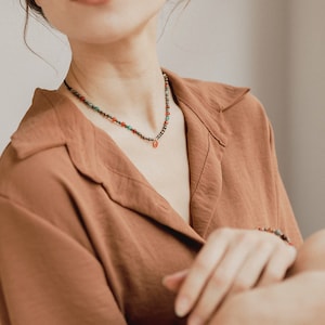 The choker matching our bracelet is shown in this photo in which the model shows a bohemian, elegant and boho look.