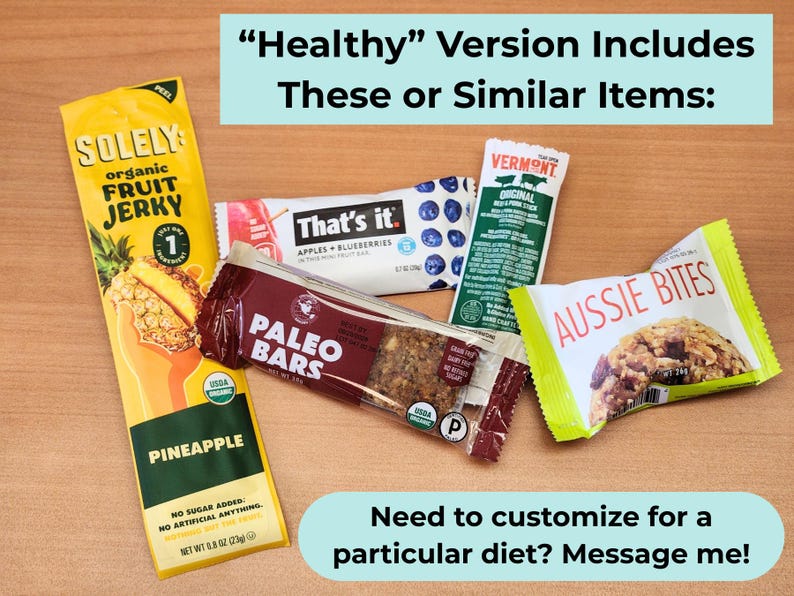 May include: An assortment of individually wrapped healthy snacks, including fruit jerky, paleo bars, and fruit and nut bars. The packaging features bright colors and product names like "Solely," "That's it," and "Aussie Bites."