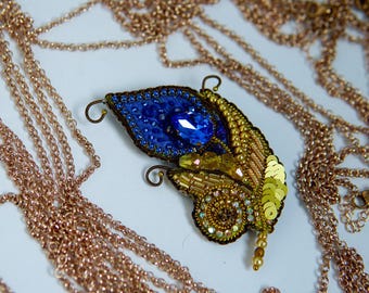 Broche de pluma de pavo real real / Broche de cristal con cuentas azules y doradas / Joyería de alta costura hecha a mano