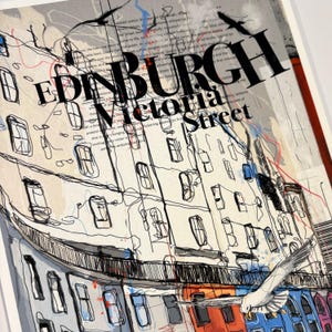 May include: A black and white illustration of a street scene in Edinburgh, Scotland. The text "EDINBURGH Victoria Street" is visible in the image.