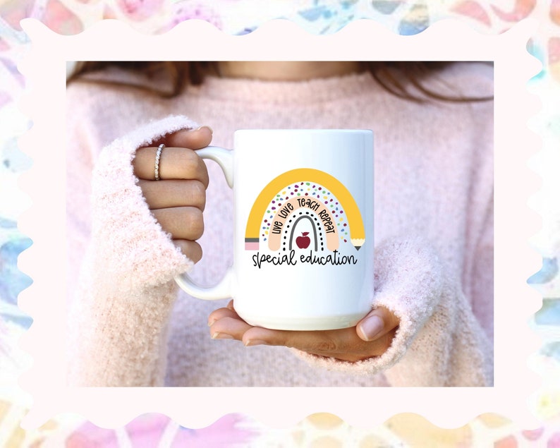 May include: White ceramic mug with a yellow rainbow design and the text "Live Love Teach Repeat Special Education".