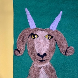 Wool painting of goat face, needle felted picture