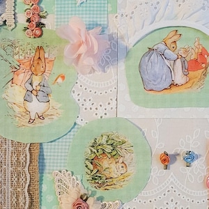 May include: A collage featuring various fabrics and embellishments. It includes images of rabbits, lace doilies, floral accents, and the text "bunny friends." The color palette consists of blues, greens, pinks, and creams, creating a vintage aesthetic.