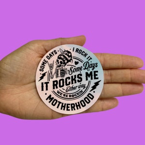 Some Days I Rock It Some Days It Rocks Me Either Way We&#39;re Rocking Motherhood, Vinyl Sticker