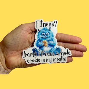 May include: A blue monster with a cookie in its hand, with the text "Fitness? Imma fitness whole cookie in my mouth!"