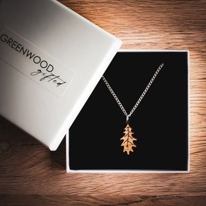 Oak leaf pendant necklace made from oak wood and fixed to a silver plated chain. Presented in a luxury white laminated Greenwood Gifted branded gift box.
