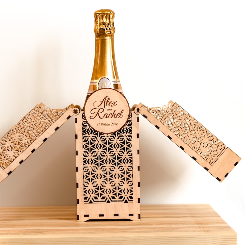 Personalised champagne gift box displayed open, showing the top half folding out to reveal the box contents. Bottle not included with your order.
