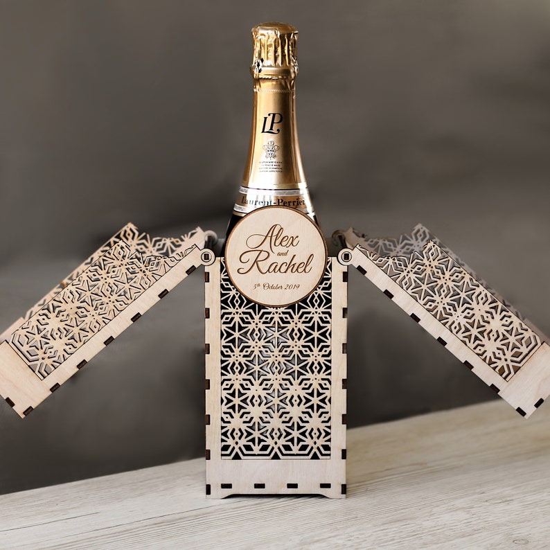 Personalised gift box for a bottle or bottle sized items. Intricately cut and custom engraved using a laser. Complete with your choice of text on the front and back and a unique, stunning fold out design made from wood.