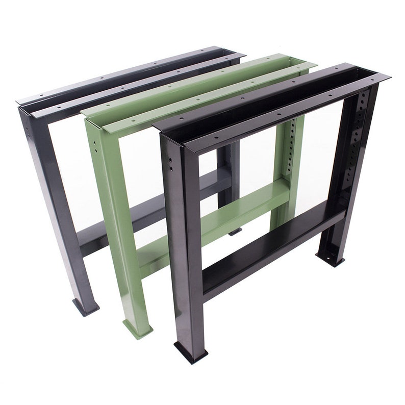 May include: Three metal table legs in black, green, and gray. The legs are made of square tubing and have a simple, industrial design.