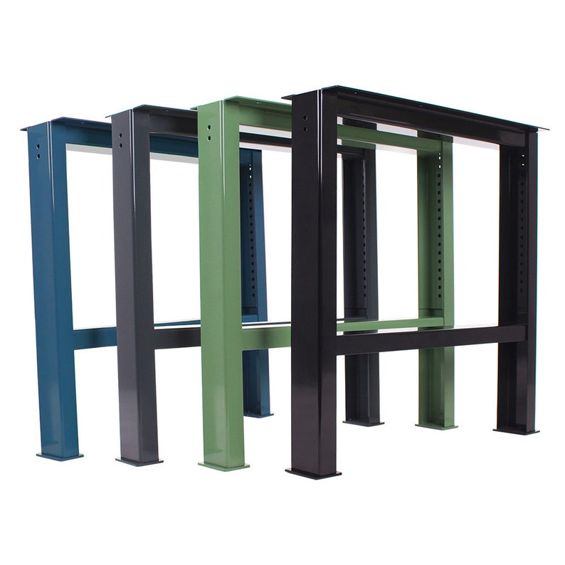 May include: Three metal table legs in different colors: teal, black, and green. Each leg has a rectangular shape with a horizontal bar connecting the two vertical supports.