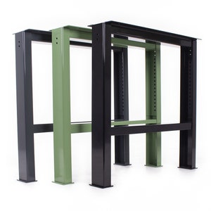 May include: Three metal table legs in black and green. The legs are made of sturdy metal and have a simple, industrial design.