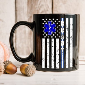 Personalized Custom Name EMS EMT Paramedic, Thin White Line Star of Life, American Flag First Responder Black Ceramic Coffee Tea Mug.