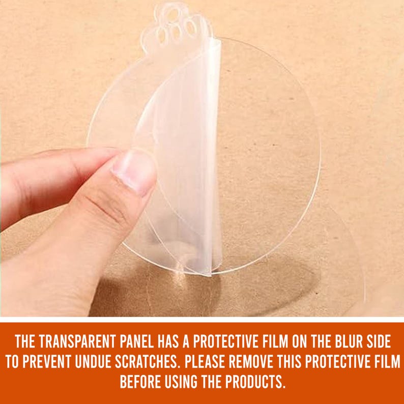 May include: A clear, round, adhesive sticker with a protective film on one side. The film is being peeled back to reveal the adhesive side of the sticker.