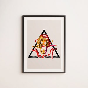 May include: Framed art print with a stylized portrait inside a black triangle. The portrait uses pixelated elements in red, yellow, and orange, set against a neutral background. The artwork is framed in a black border.
