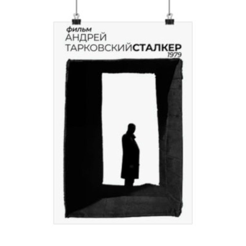 May include: Black and white poster for the film "Stalker" by Andrei Tarkovsky. The poster features a silhouette of a person standing in a doorway.