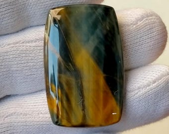 Blauwe tijgeroog cabochon: gepolijste haviksoog-edelsteen (35 x 22 x 4 mm)