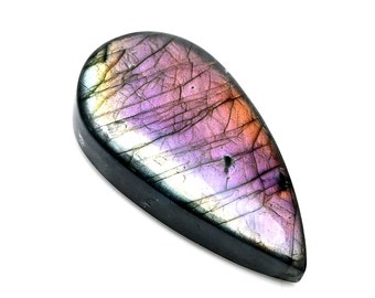 May include: A teardrop-shaped gemstone with a polished surface. The stone displays a vibrant array of colors, including purple, pink, orange, and yellow, with dark veins running throughout. The gemstone has a black border and is set against a white background.