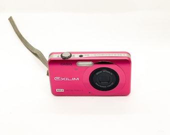 Casio Exilim EX-Z90 compact digicam in pink with charger and battery