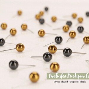 May include: A set of 100 pushpins, 50 gold and 50 black, with round heads. Includes Pushpin Set 50pcs of gold + 50pcs of black