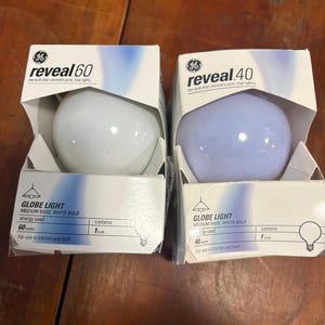 GE Reveal Globe Light Bulbs. 1 60 watt & 1 40 watt bulb