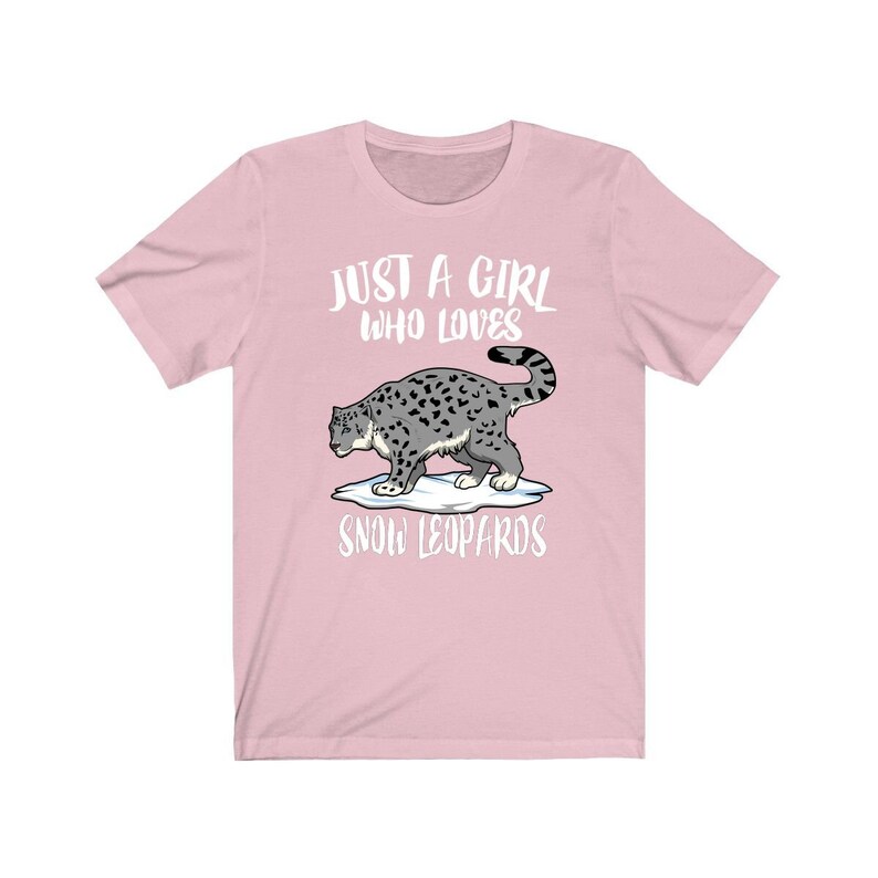 May include: Pink t-shirt with a white graphic of a snow leopard and the text "Just a girl who loves snow leopards".