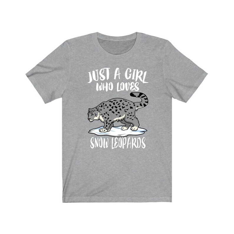 May include: Gray t-shirt with the text "Just a girl who loves snow leopards" and a cartoon image of a snow leopard walking on a patch of snow.