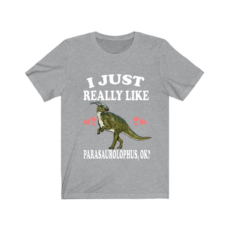 May include: Grey t-shirt with white text that reads "I just really like Parasaurolophus, ok?" and a cartoon image of a Parasaurolophus dinosaur.