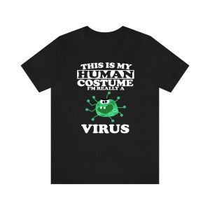 May include: Black t-shirt with the text "THIS IS MY HUMAN COSTUME I'M REALLY A VIRUS" in white. A green cartoon virus with black eyes and green spikes is in the center of the shirt. The shirt is made of a soft material.