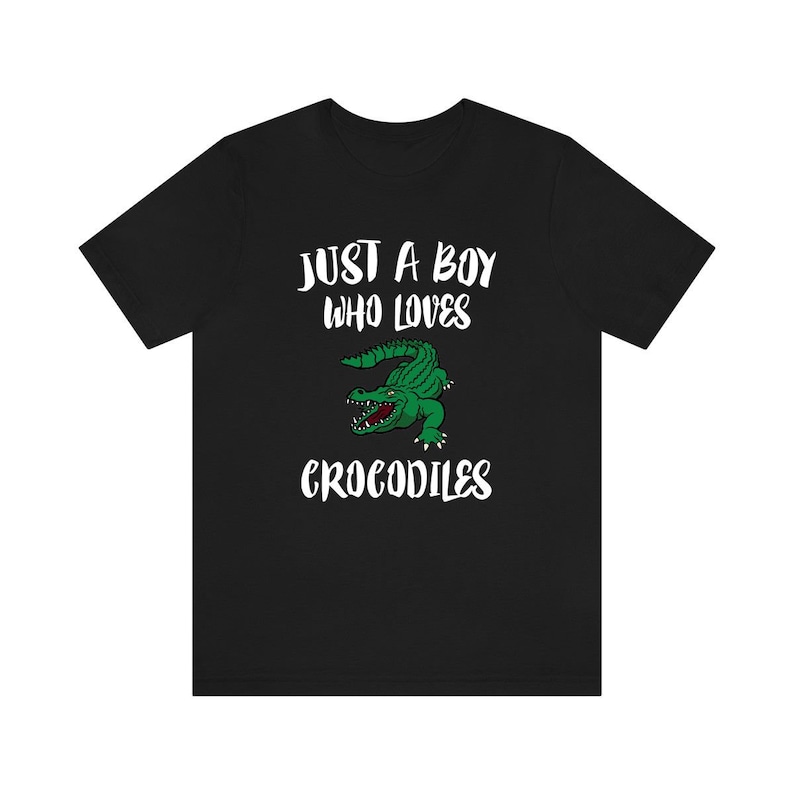 May include: Black t-shirt with a white graphic that says "Just a boy who loves crocodiles" and a green crocodile illustration.