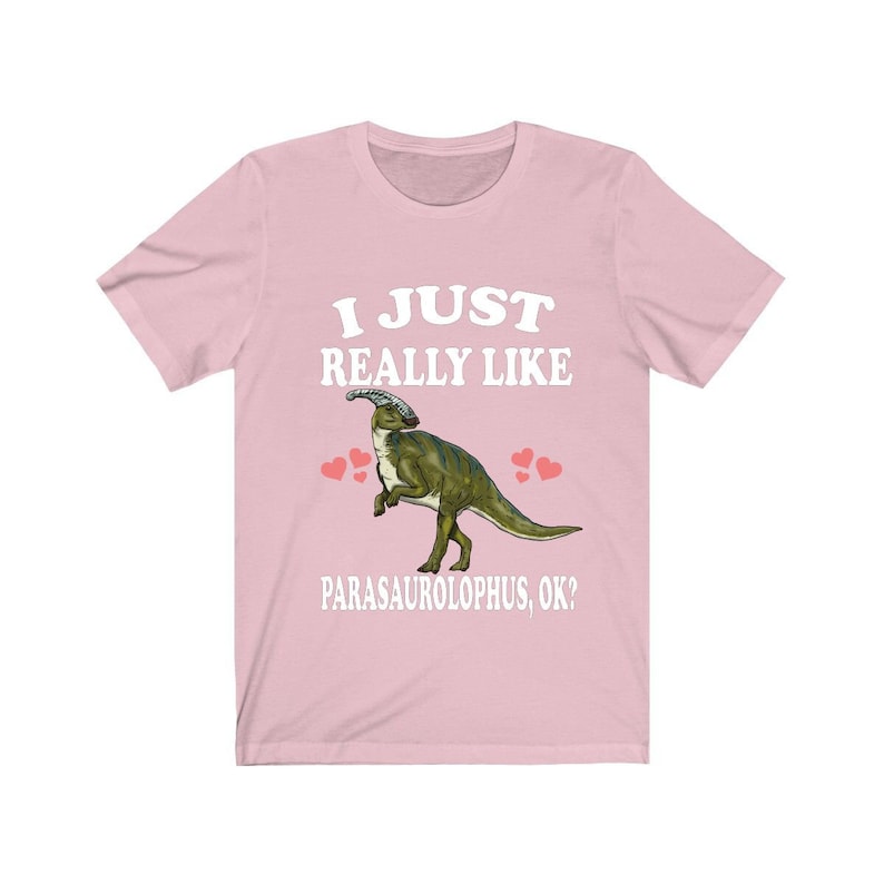 May include: Pink t-shirt with a white graphic of a Parasaurolophus dinosaur with the text "I just really like Parasaurolophus, ok?"