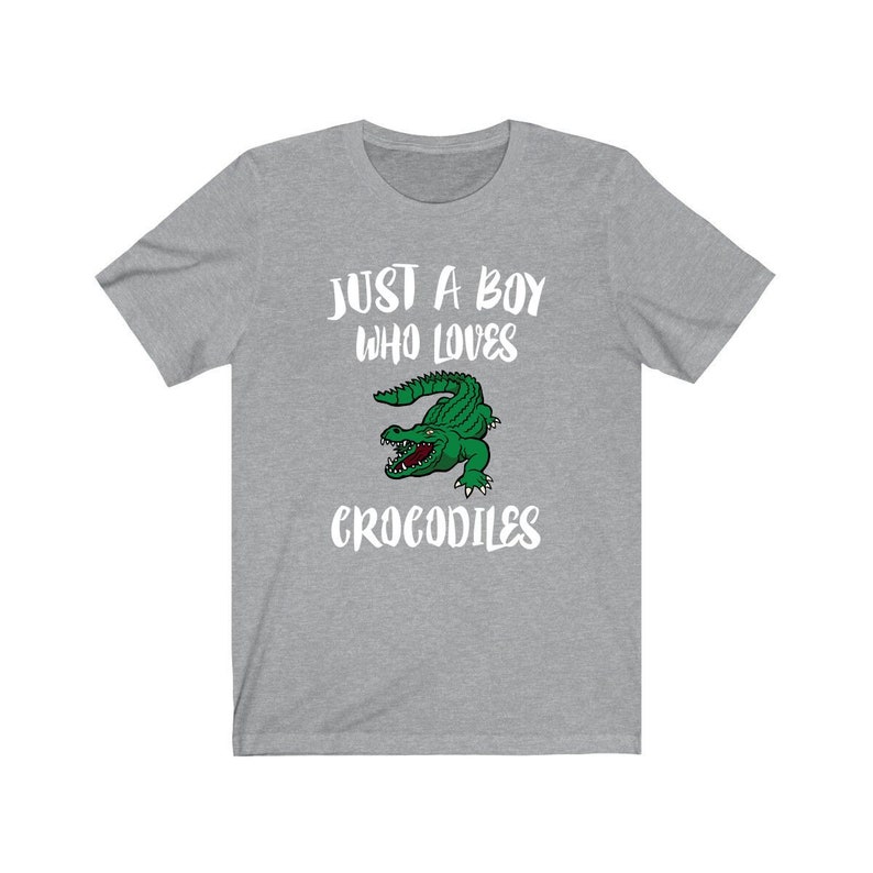 May include: Gray t-shirt with a white graphic that says "Just a boy who loves crocodiles" and a cartoon crocodile.