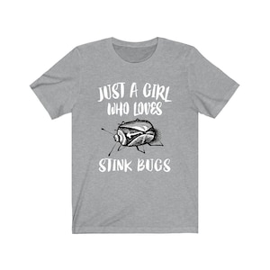 May include: Gray t-shirt with the text "Just a girl who loves stink bugs" and a black and white illustration of a stink bug.
