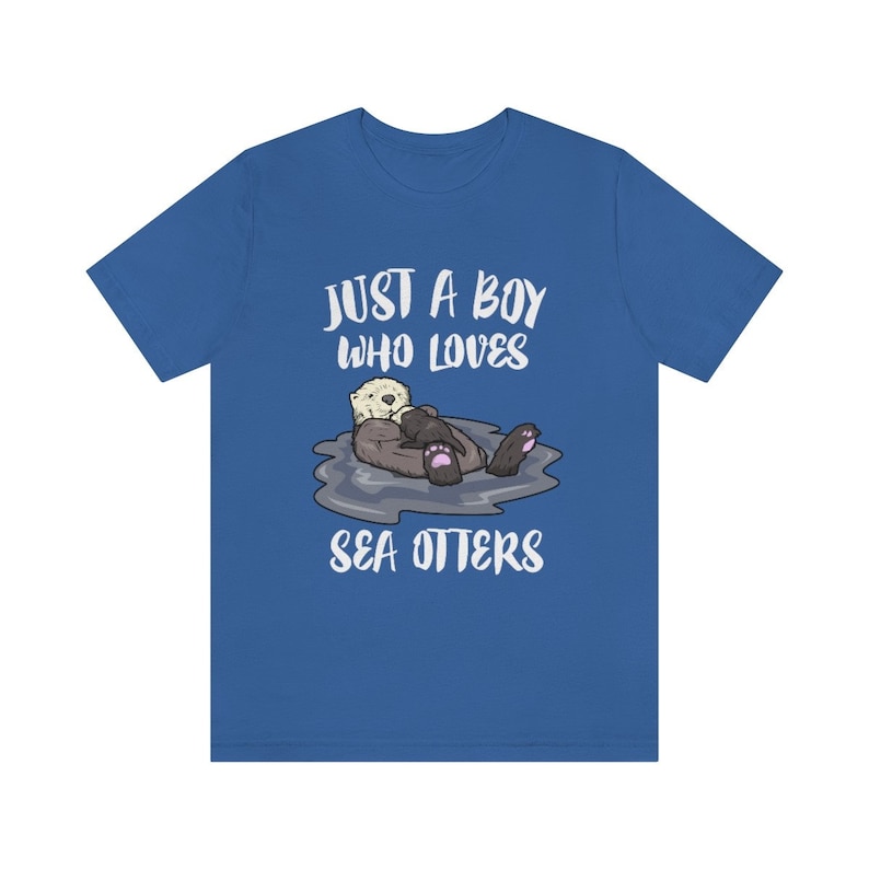 May include: A royal blue t-shirt with the text "Just a boy who loves sea otters" and a cartoon image of a sea otter holding a baby sea otter.