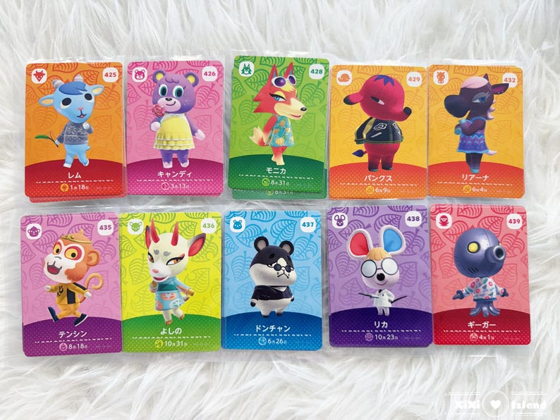 May include: Ten Animal Crossing character cards are displayed, each featuring a different anthropomorphic animal. The cards have colorful backgrounds and character names in Japanese. Each card has a unique number and character illustration.