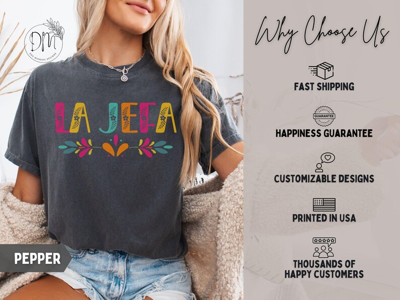 May include: Dark grey t-shirt with the word "LA JEFA" in colourful letters and floral accents. The shirt also has the word "PEPPER" printed at the bottom. The image also includes text that says "Why Choose Us".