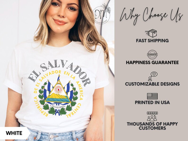 May include: A white short-sleeve t-shirt featuring the coat of arms of El Salvador in the center, surrounded by the text "REPUBLICA DE EL SALVADOR EN LA AMERICA CENTRAL" and "EL SALVADOR" in a circular arc above the national emblem.