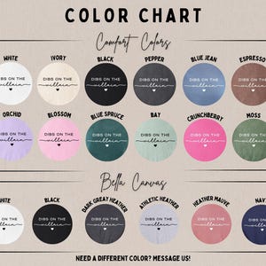 May include: Color chart showcasing various Comfort Colors and Bella Canvas options. Each color is displayed in a circular design with the text "DIBS ON THE villain" and a heart. The chart includes colors like white, black, blue jean, and more.