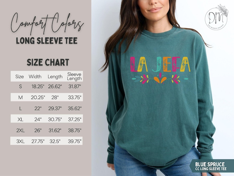May include: Teal long-sleeve tee with the word "LA JEFA" in colourful letters. The shirt has a size chart with measurements in inches. The text "Comfort Colors" and "BLUE SPRUCE CC LONG SLEEVE TEE" are also visible.