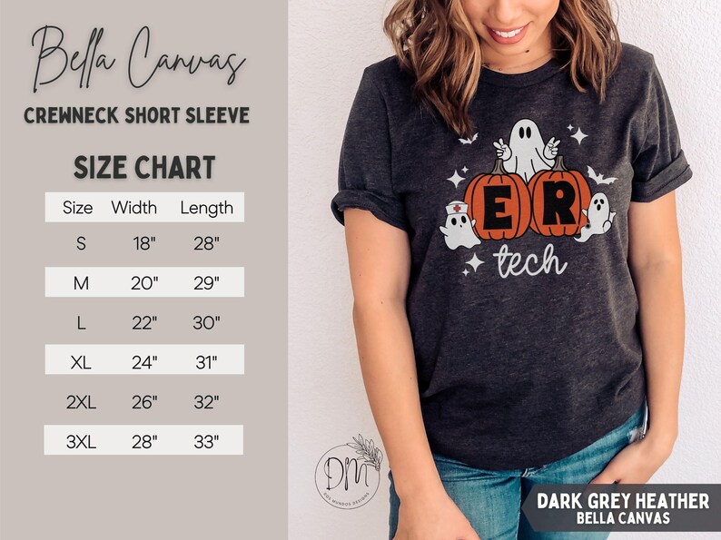 May include: A dark grey heather crewneck short sleeve t-shirt featuring a graphic of two orange pumpkins with the letters E and R, surrounded by three white ghosts, bats, and stars, with the text tech below. Includes a size chart in inches.