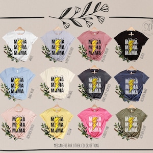 a bunch of shirts that are on a hanger