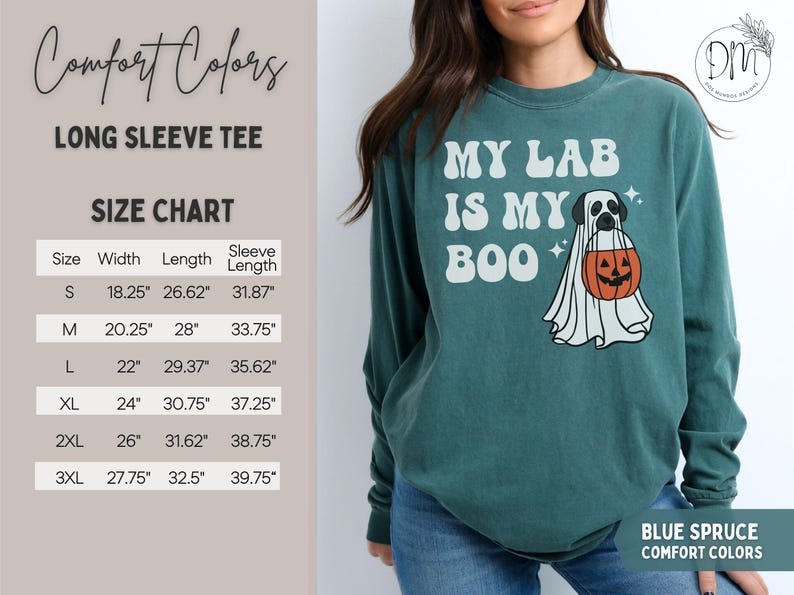 May include: A blue spruce long-sleeve t-shirt featuring a graphic of a Labrador retriever dressed as a ghost holding a jack-o'-lantern bucket with the text MY LAB IS MY BOO. A size chart is visible on the left with measurements in inches.