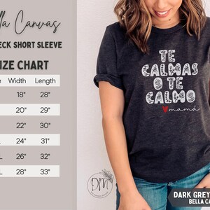 May include: Dark grey heather Bella Canvas crewneck short sleeve t-shirt. The shirt features the text "TE CALMAS O TE CALMO mam&aacute;" in white, with a red heart. A size chart is displayed, with measurements in inches.
