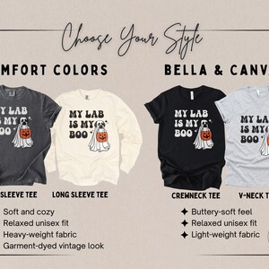 May include: Four t-shirts in charcoal, cream, black, and light grey featuring a graphic of a dog in a ghost costume holding an orange pumpkin bucket. The text reads MY LAB IS MY BOO. The image displays short sleeve, long sleeve, crewneck, and v-neck styles.