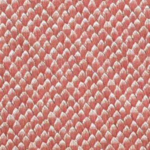 May include: A close-up of a pink fabric with a textured pattern of small, overlapping scales.