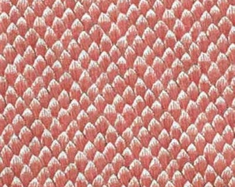 May include: A close-up of a pink fabric with a textured pattern of small, overlapping scales.