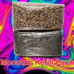 May include: Two clear plastic bags filled with a Monotub Refill Pack. The top bag contains a mix of brown and black seeds. The bottom bag contains a black powder.
