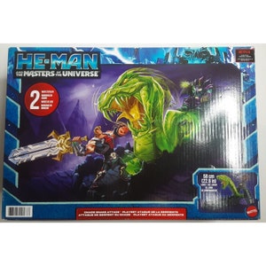 May include: He-Man and the Masters of the Universe playset featuring a green snake with a large mouth, a figure of He-Man with a sword, and a smaller figure of a character with a purple cape. The playset is 22.8 inches long and includes multiple components.