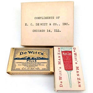 May include: Three vintage boxes of De Witt's brand medications. The top box is white with black text that reads "Compliments of E.C. De Witt & Co., Inc. Chicago 14, Ill.". The middle box is gold with black text that reads "De Witt's Pills A diuretic stimulant for the kidneys Promote the flow of urine Active Ingredients: Potash Nitrate, Uva Ursi, Buchu, Methylene Blue Manufactured by E.C. De Witt & Co. Chicago, Ill.". The bottom box is red and white with black text that reads "De Witt's Man Zan Man Zan For Alleviating Irritable Indigestion Active Ingredients: Sodium Bicarbonate, Magnesium Carbonate, Pepsin, Milk Sugar De Witt's Man Zan".